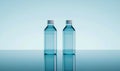 Two Transparent Water Bottles with Reflection on a Glass Surface Royalty Free Stock Photo