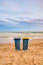 Two trash cans on the beach Royalty Free Stock Photo