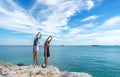 Two traveler young women seeing the beautiful beach and blue sky, so happy and relax. Royalty Free Stock Photo
