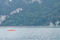 Travellers are sailing the orange boat in the sea in thailand