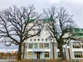 Two trees in front of the building Royalty Free Stock Photo