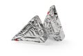 Two triangular pieces of foil wrapped processed creame cheese isolated on a white background. Tasty soft cheese in a silver