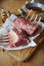 Two trimmed and seasoned raw racks of lamb Royalty Free Stock Photo