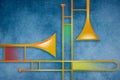 Two trombones are seen in a colorful graphic image about music and brass instruments