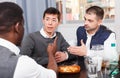Serious men talking with friend at home Royalty Free Stock Photo