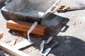 Various masonry and brickwork tools being used on a construction site