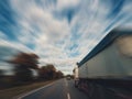 Two trucks is driving on an empty highway Royalty Free Stock Photo