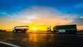 Two trucks on highway in motion blur at sunset Royalty Free Stock Photo