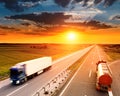 Two trucks in motion blur on the highway Royalty Free Stock Photo