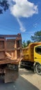 Two trucks pass each other on the road