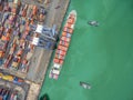 two tug boat towing cargo container in warehouse harbor at thailand . Royalty Free Stock Photo