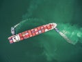 two tug boat towing cargo container in warehouse harbor at thailand . Royalty Free Stock Photo