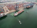 two tug boat towing cargo container in warehouse harbor at thailand . Royalty Free Stock Photo