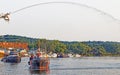 Tugboats arriving harbor event under water spray arc Royalty Free Stock Photo