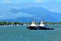 Two tugboats sail at the entrance to Trinity Inlet in Queenslan