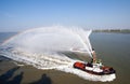 Two tugs spraying water in celebration