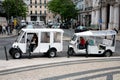 Two tuk tuks with drivers waiting for tourists in the centre of the Chiado district of Lisbon,