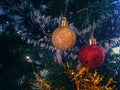 Two tumbling balls add to the beauty of the Christmas tree Royalty Free Stock Photo