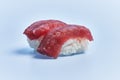 Two tuna nigiris sushi over blue background Royalty Free Stock Photo