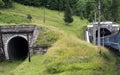 Two tunnels in the Carpathians with entering train Royalty Free Stock Photo