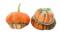 Two turban squash, one with stem, one showing striped gourd Royalty Free Stock Photo