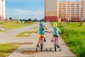 Two Twin Brothers Riding Bikes Together Royalty Free Stock Photo