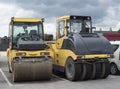 Two types of asphalt rollers next to each other close