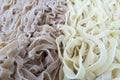 Fresh wheet and white uncooked linguni pasta Royalty Free Stock Photo