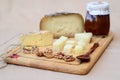 Two types of sheep cheese cut into cubes displayed on a cutting board Royalty Free Stock Photo