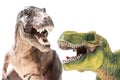 Two Tyrannosaurus Rex figurines on white Royalty Free Stock Photo