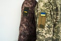 Two ukrainian soldiers in pixel military uniform with flag of Ukraine banner Royalty Free Stock Photo