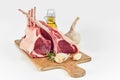 Two uncooked fatty racks of lamb with ingredients Royalty Free Stock Photo