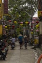 Two unidentified asian female tourists in traditional vietnamese conical hats