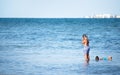 Two unidentified children snorkeling on the beach Royalty Free Stock Photo