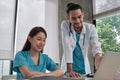 Two uniformed young doctors work in medical clinic office Royalty Free Stock Photo