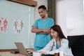 Two uniformed young doctors work in medical clinic office Royalty Free Stock Photo