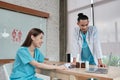 Two uniformed young doctors work in medical clinic office Royalty Free Stock Photo