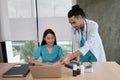 Two uniformed young doctors work in medical clinic office Royalty Free Stock Photo