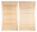 Two unpainted wooden shutters