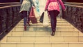 Two unrecognisable young female friends enjoying a day out shopping