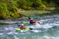 Two unrecognizable kayakers in the emerald water Royalty Free Stock Photo