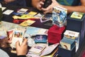 Two white Caucasian kids playing with Pokemon trading cards on a table Royalty Free Stock Photo