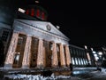 Two unrecognizable women taking photos at the sterps of the Marche Bonsecours in Montreal Old Port Quebec with traditional