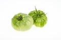 Two unripe green tomatoes isolated on white background. Studio Photo Royalty Free Stock Photo