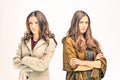 Two upset young women with different opinions Royalty Free Stock Photo