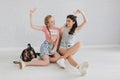 Two urban teen girls posing in a vintage room Royalty Free Stock Photo