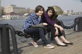 Two urban teen girls sitting on stairs Royalty Free Stock Photo