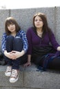 Two urban teen girls sitting on stairs Royalty Free Stock Photo