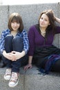 Two urban teen girls sitting on stairs Royalty Free Stock Photo