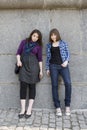 Two urban teen girls standing at wall. Royalty Free Stock Photo